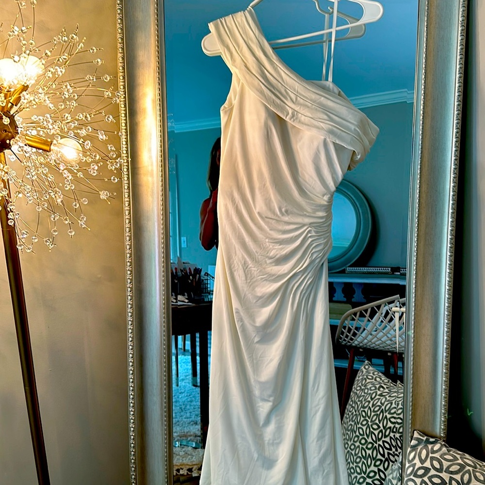 Designer: MacDuggal....White long gown with ruching off one shoulder!